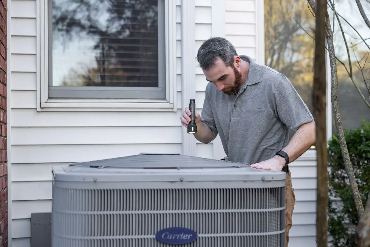 Engineer servicing a ventilation system for Ellis Refrigeration